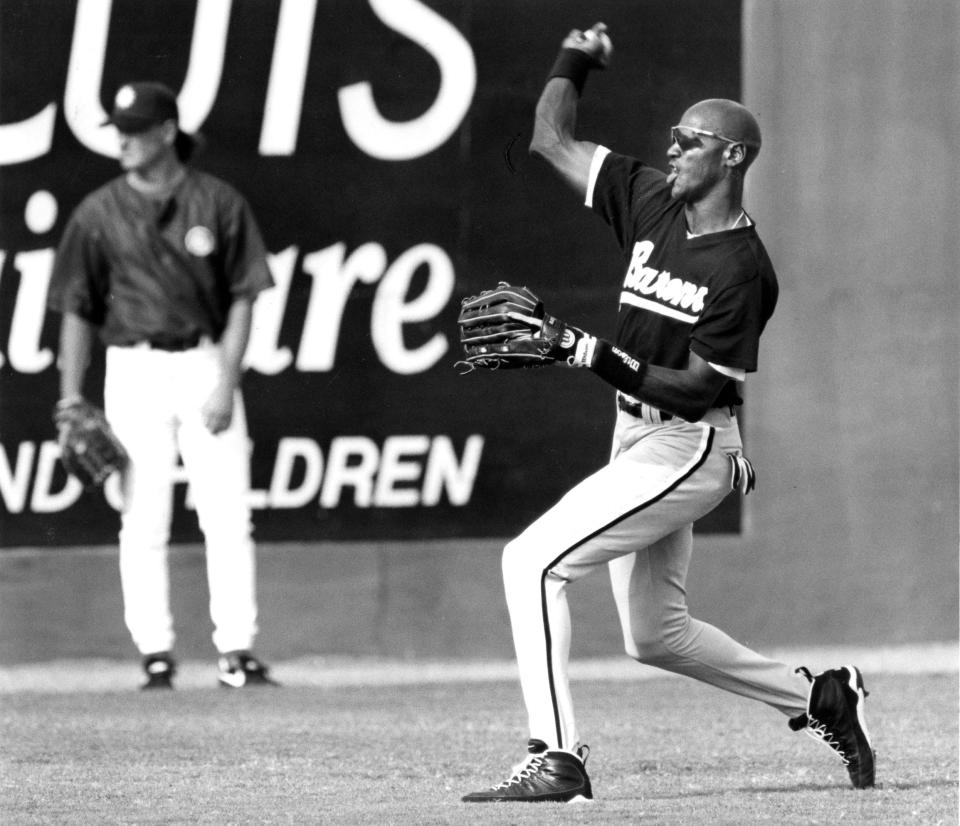 Birmingham Barons outfielder Michael Jordan warms up before the May 12, 1994, game against the Jacksonville Suns, who drew a then-record crowd eager to see the NBA star try baseball.