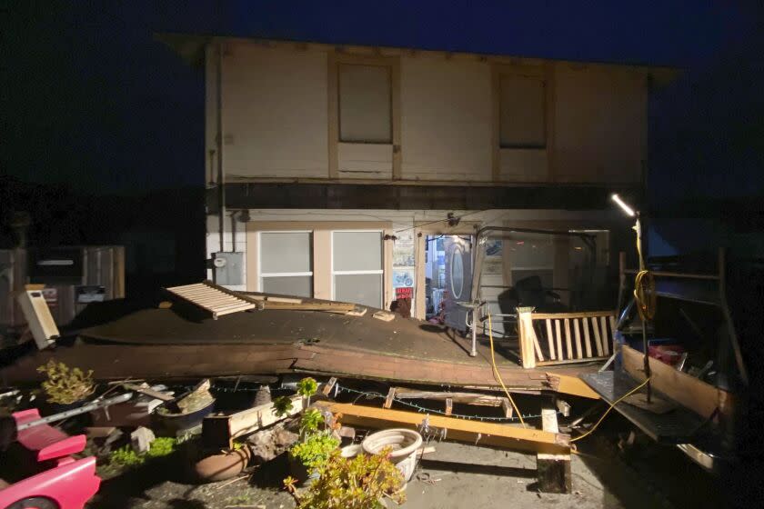 Earthquake damage is seen outside a building in Rio Dell, Calif., Tuesday, Dec. 20, 2022. A strong earthquake shook parts of Northern California early Tuesday, jolting residents awake, cutting off power to thousands, and causing some damage to buildings and roads, officials said. (Kent Porter/The Press Democrat via AP)