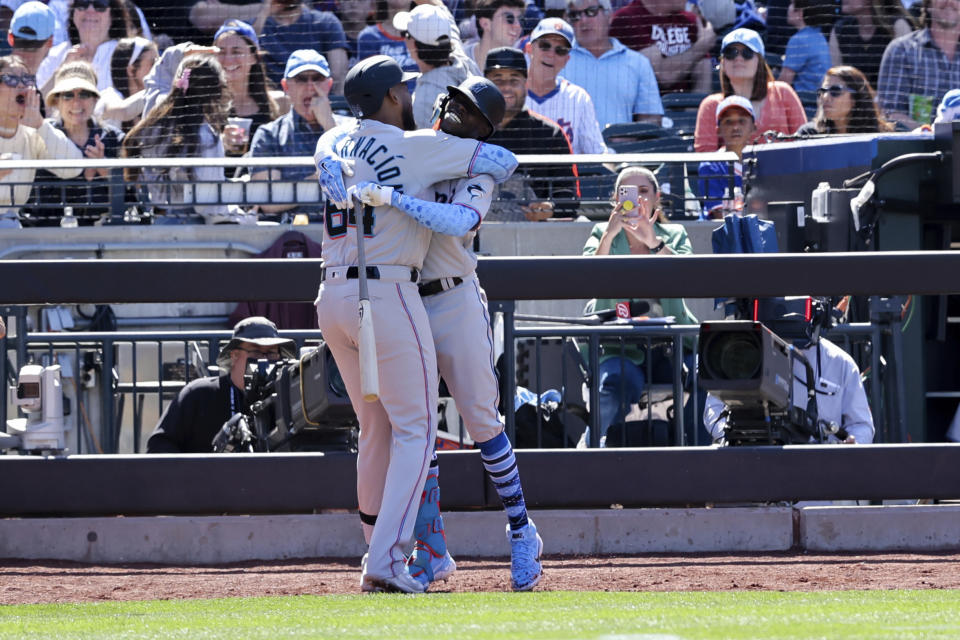 Miami Marlins' Jerar Encarnacion (64) celebrates with Jazz Chisholm Jr. after hitting a grand slam against New York Mets relief pitcher Seth Lugo during the seventh inning of a baseball game, Sunday, June 19, 2022, in New York. (AP Photo/Jessie Alcheh)