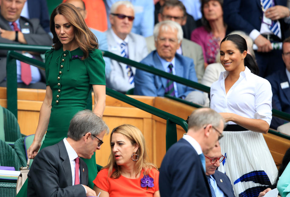 The Duchess of Cambridge and The Duchess of Sussex on day twelve of the Wimbledon Championships at the All England Lawn Tennis and Croquet Club, Wimbledon.