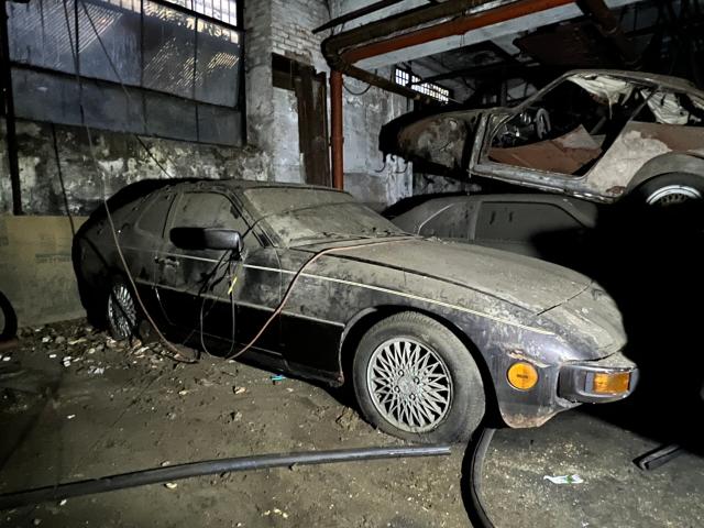 Old Car in a Garage Rug by moonfluff