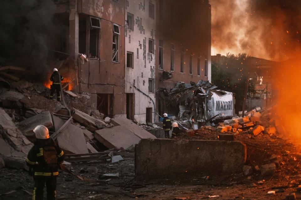 Firefighters work at the site of fire after Russian shelling in Mykolaiv, Ukraine, where Lesia Tsurenko is from (George Ivanchenko/AP/PA) (AP)