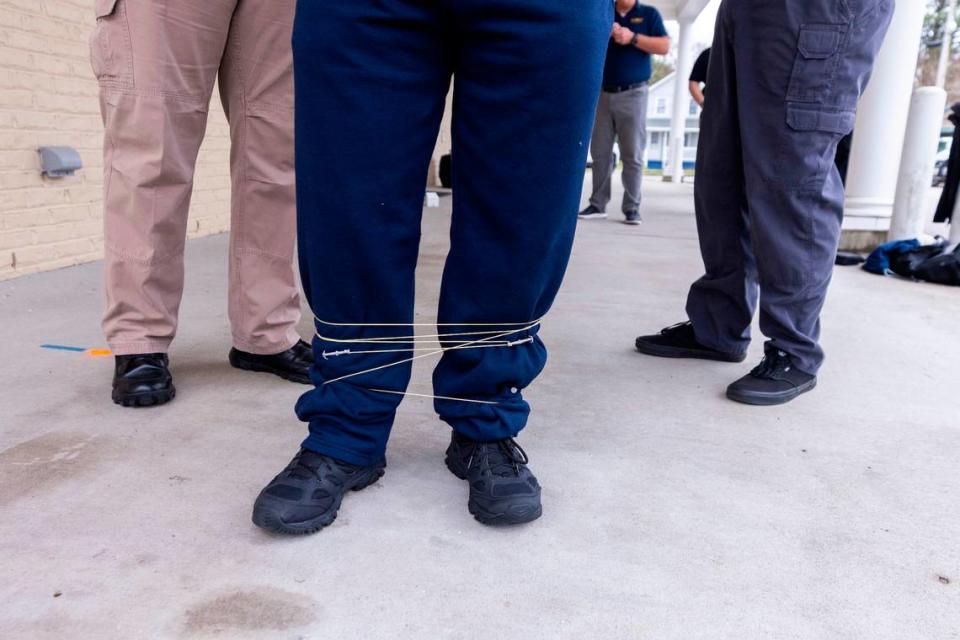 Edenton police officers train with BolaWrap, a restraint device that police departments across the country are trying. Edenton was the first department to use BolaWrap in North Carolina in 2019.