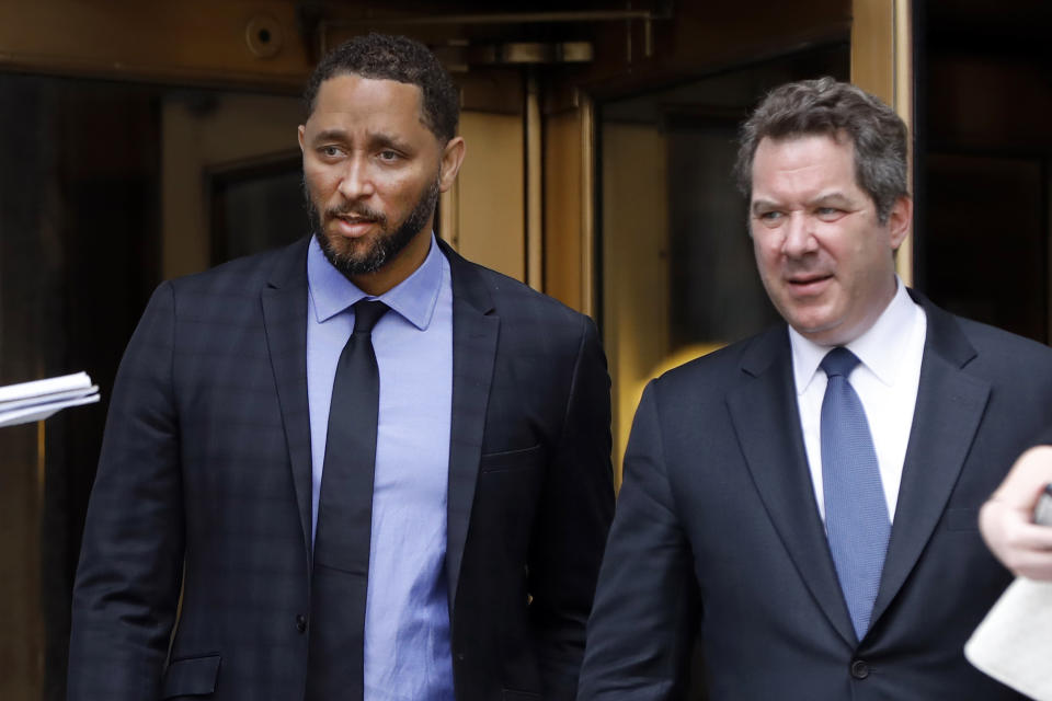Former assistant basketball coach for the University of Southern California Tony Bland, left, and his attorney Jeffrey Lichtman, leave federal court in New York, Wednesday, June 5, 2019. Bland was the first of four ex-coaches charged with crimes to plead guilty to bribery conspiracy. He was sentenced to 100 hours of community service and two years of probation. (AP Photo/Richard Drew)