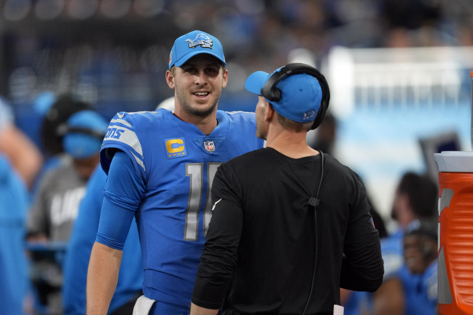 Detroit Lions quarterback Jared Goff talks to a coach during the second half of an NFL football game against the Jacksonville Jaguars, Sunday, Dec. 4, 2022, in Detroit. (AP Photo/Paul Sancya)