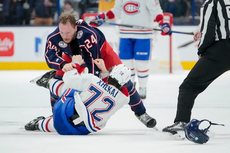 Nov 17, 2022; Columbus, Ohio, USA;  Columbus Blue Jackets right wing Mathieu Olivier (24) fights Montreal Canadiens defenseman Arber Xhekaj (72) during the second period of the NHL hockey game at Nationwide Arena. Mandatory Credit: Adam Cairns-The Columbus Dispatch