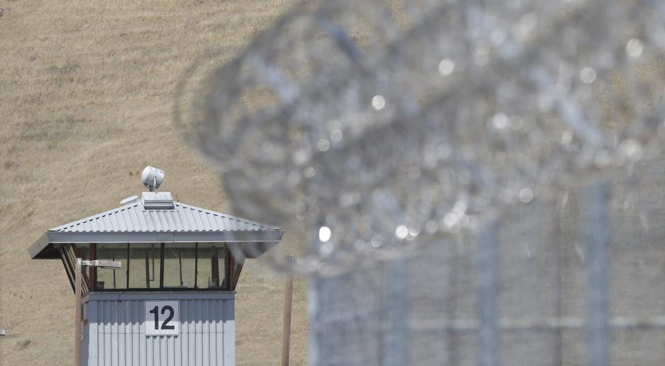 A guard tower and razor wire are seen at California State Prison Solano in Vacaville.