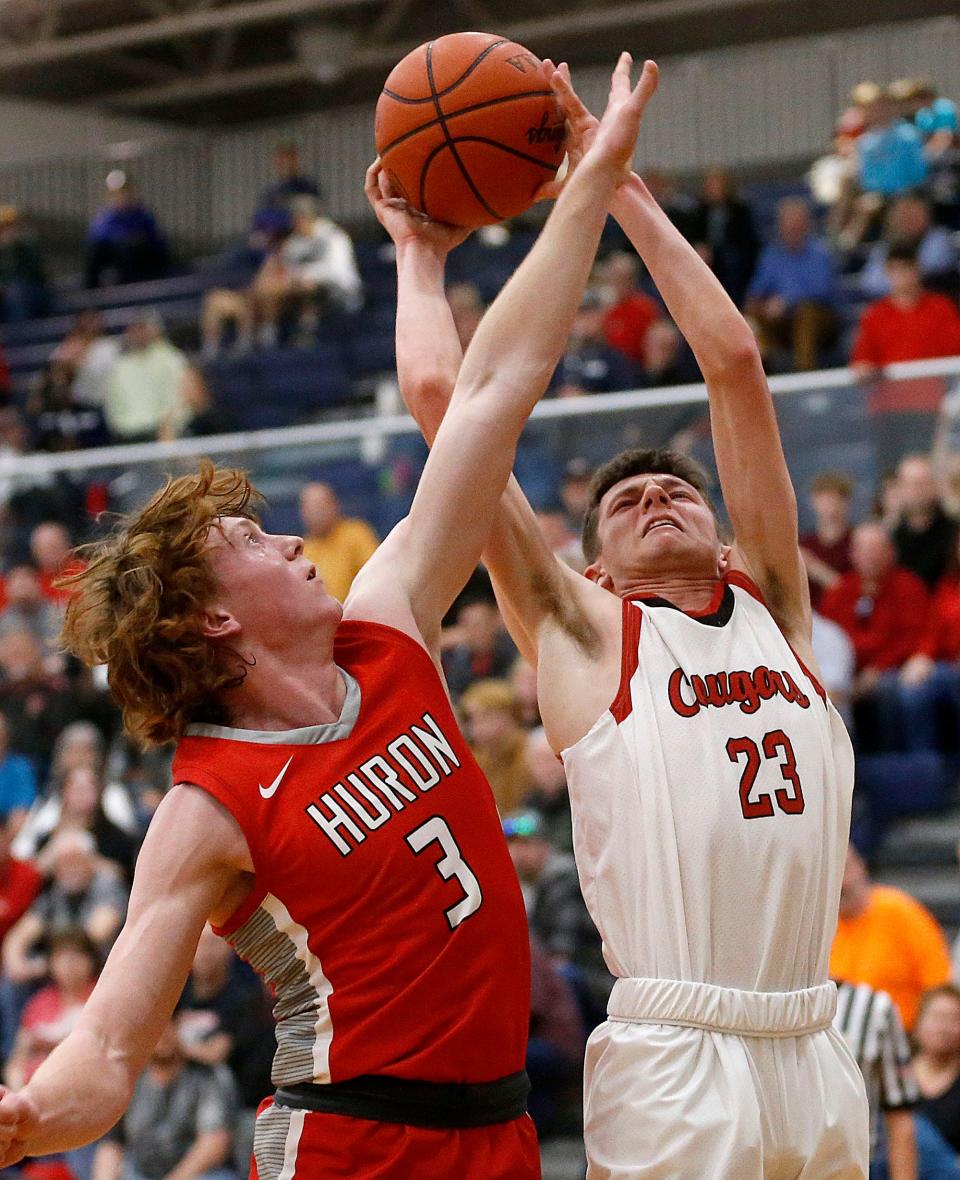 Crestview High School's Jarek Ringler (23) shoots against Huron High School's Jake Lagando (3) during their Division III district semifinal high school boys basketball game at Norwalk High School Wednesday, March 1, 2023. TOM E. PUSKAR/ASHLAND TIMES-GAZETTE