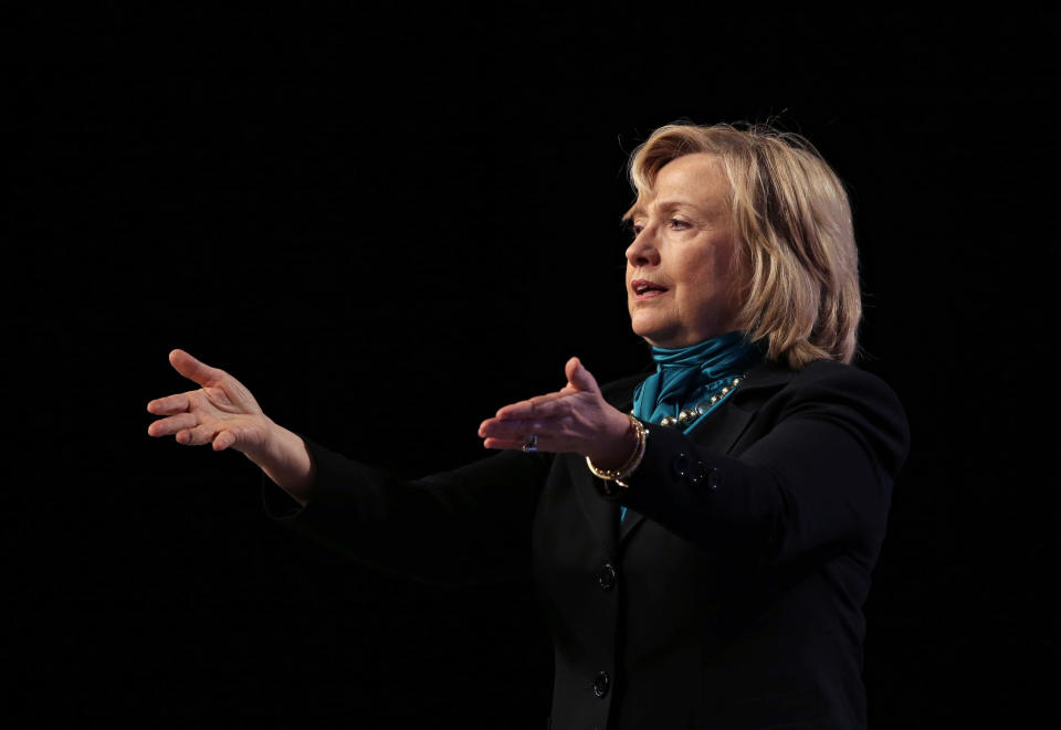 Former Secretary of State Hillary Rodham Clinton speaks to the National Automobile Dealers Association meeting in New Orleans, Monday, Jan. 27, 2014. (AP Photo/Gerald Herbert)