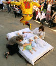 BURGOS, SPAIN - JUNE 10: A man representing the devil leaps over babies during the festival of El Colacho on June 10, 2012 in Castrillo de Murcia near Burgos, Spain. The festival, held on the first Sunday after Corpus Cristi, represents the devil taking away original sin from the newly born babies by leaping over them. (Photo by Denis Doyle/Getty Images)