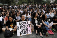 Hundreds of mothers protest against the amendments to the extradition law after Wednesday's violent protest in Hong Kong on Friday, June 14, 2019. Calm appeared to have returned to Hong Kong after days of protests by students and human rights activists opposed to a bill that would allow suspects to be tried in mainland Chinese courts. (AP Photo/Vincent Yu)