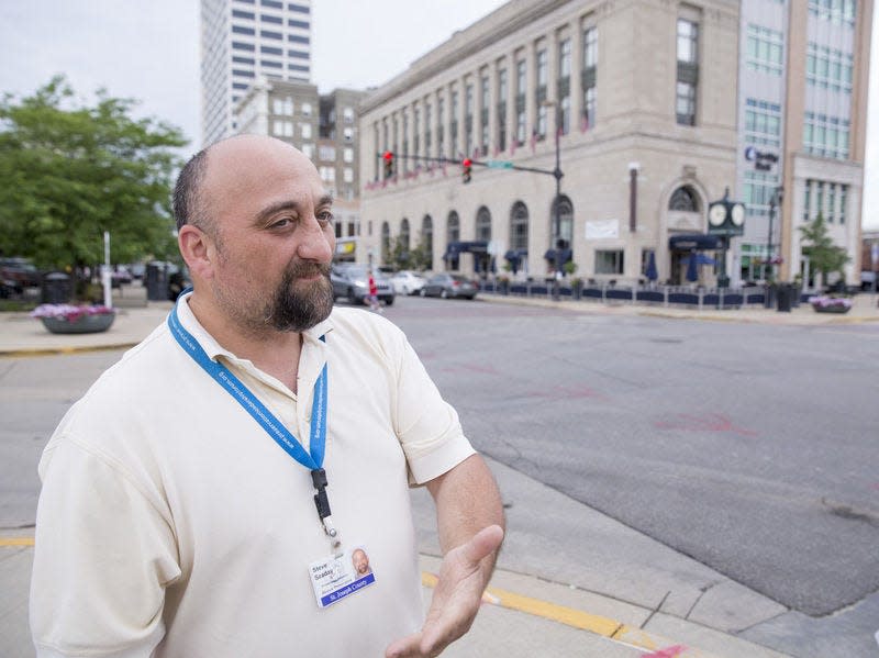 Steve Szaday, St. Joseph County Preservation Inspector, pictured in 2016 at the corner of Michigan and Washington streets, where he starts his downtown South Bend walking tours that take place on the first Friday of the month now through October. Tribune Photo/BECKY MALEWITZ