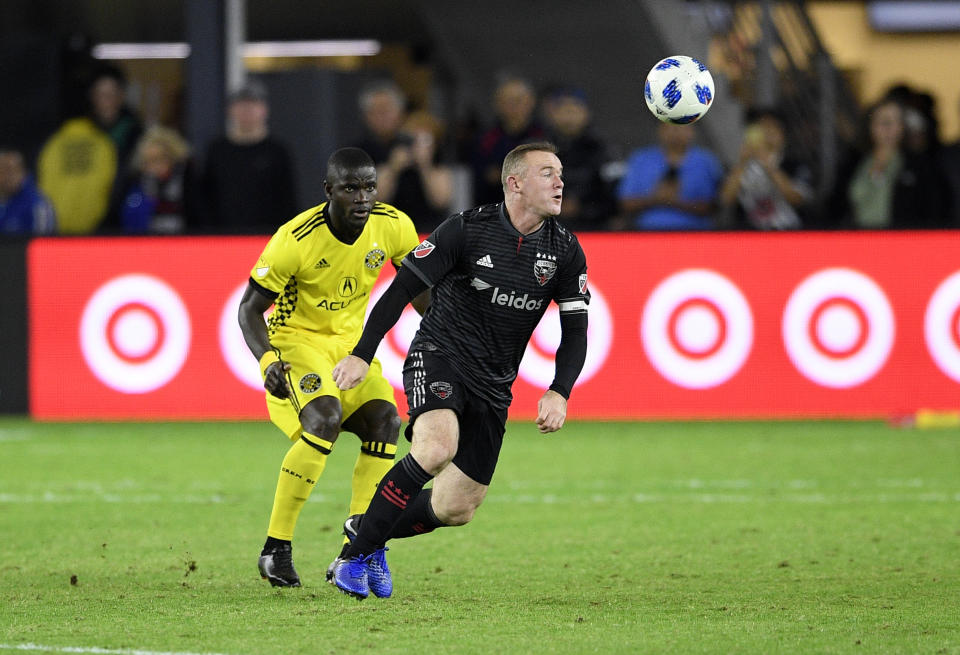 D.C. United forward Wayne Rooney, right, chases the ball during a 2018 MLS playoff match. (AP Photo/Nick Wass)