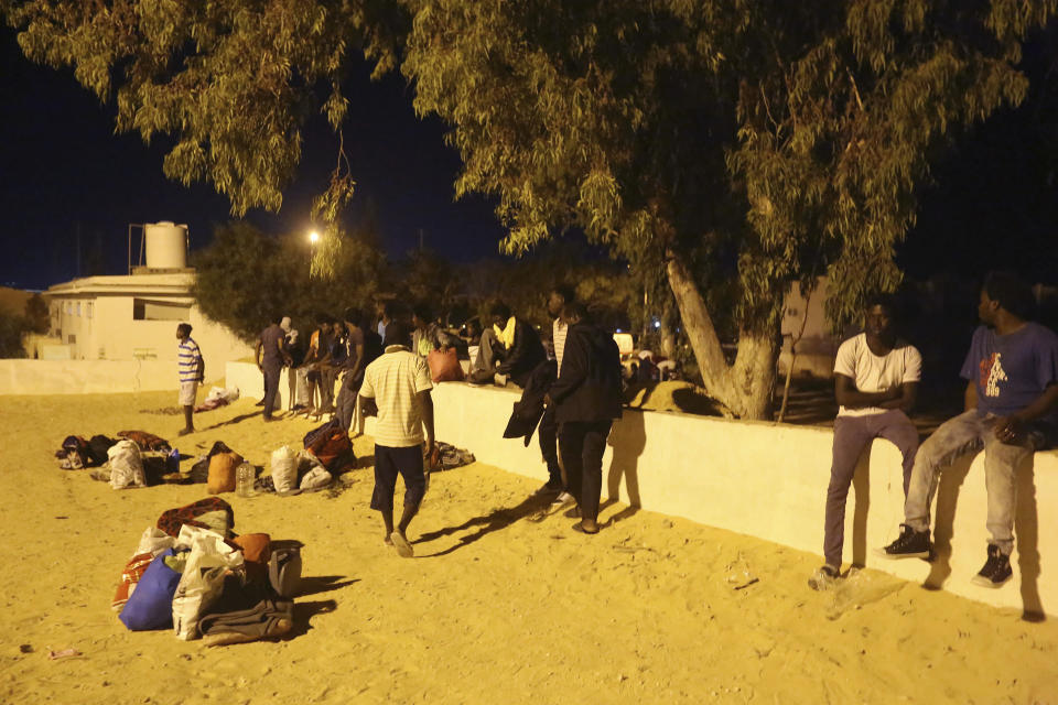 Migrants, who were not affected by an airstrike, take shelter in Tajoura, east of Tripoli Wednesday, July 3, 2019. An airstrike hit a detention center for migrants early Wednesday in the Libyan capital. (AP Photo/Hazem Ahmed) (AP Photo/Hazem Ahmed)