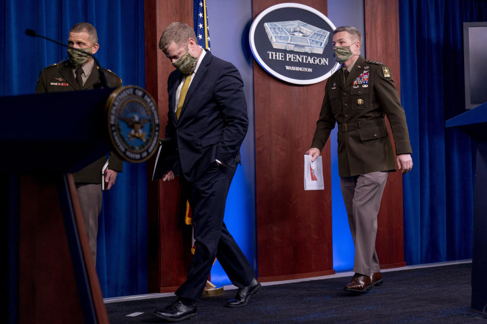 From left, Sergeant Major of the Army Michael A. Grinston, Secretary of the Army Ryan McCarthy, and Gen. James McConville, Chief of Staff of the Army, depart a briefing on an investigation into Fort Hood, Texas at the Pentagon, Tuesday, Dec. 8, 2020, in Washington. The Army says it has fired or suspended 14 officers and enlisted soldiers at Fort Hood, Texas, and ordered policy changes to address chronic leadership failures at the base that contributed to a widespread pattern of violence including murder, sexual assaults and harassment. (AP Photo/Andrew Harnik)