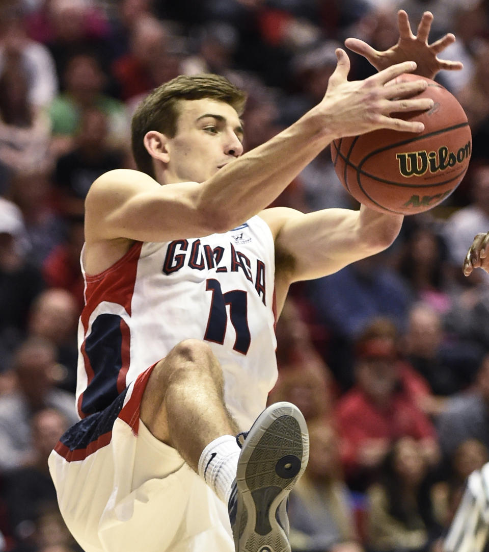 Gonzaga guard David Stockton pulls in a loose ball during the second half in a second-round game against Oklahoma State in the NCAA men's college basketball tournament Friday, March 21, 2014, in San Diego. (AP Photo/Denis Poroy)