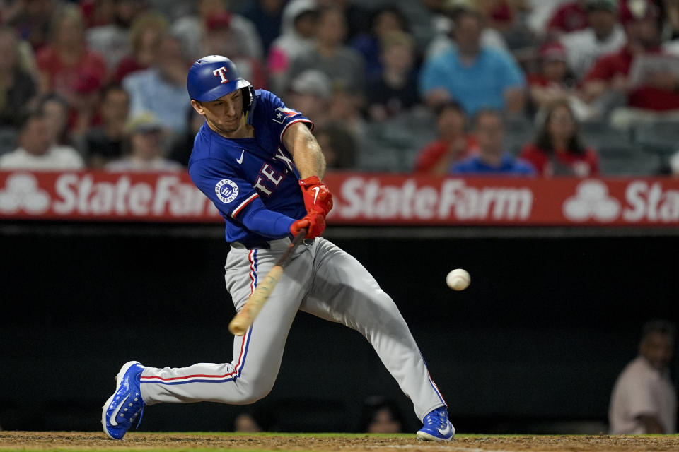 Texas Rangers' Wyatt Langford hits a two-run home run during the seventh inning of a baseball game against the Los Angeles Angels, Monday, July 8, 2024, in Anaheim, Calif. (AP Photo/Ryan Sun)