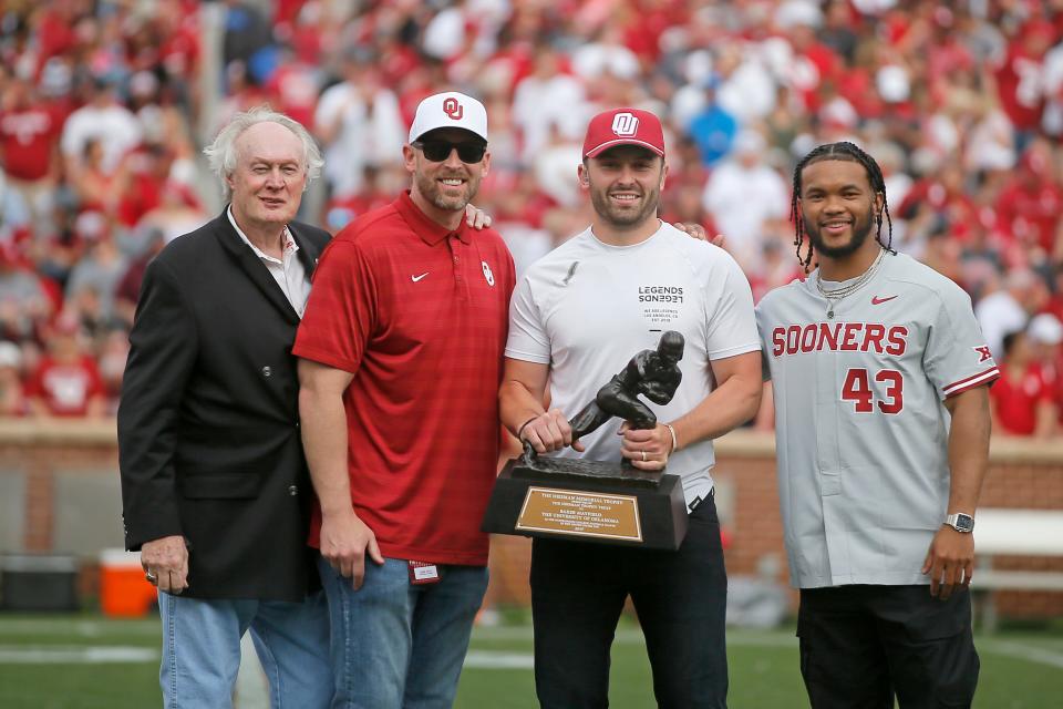 Former Oklahoma Heisman Trophy winners from left,  Steve Owens, Jason White, Baker Mayfield and Kyler Murray pose for a photo  April 23, 2022, during the University of Oklahoma's annual spring football game at Gaylord Family-Oklahoma Memorial Stadium in Norman.