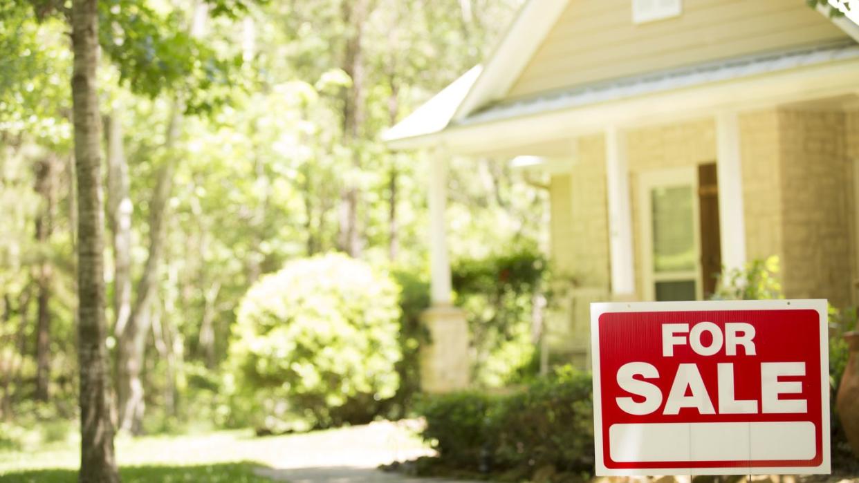 home for sale with real estate sign