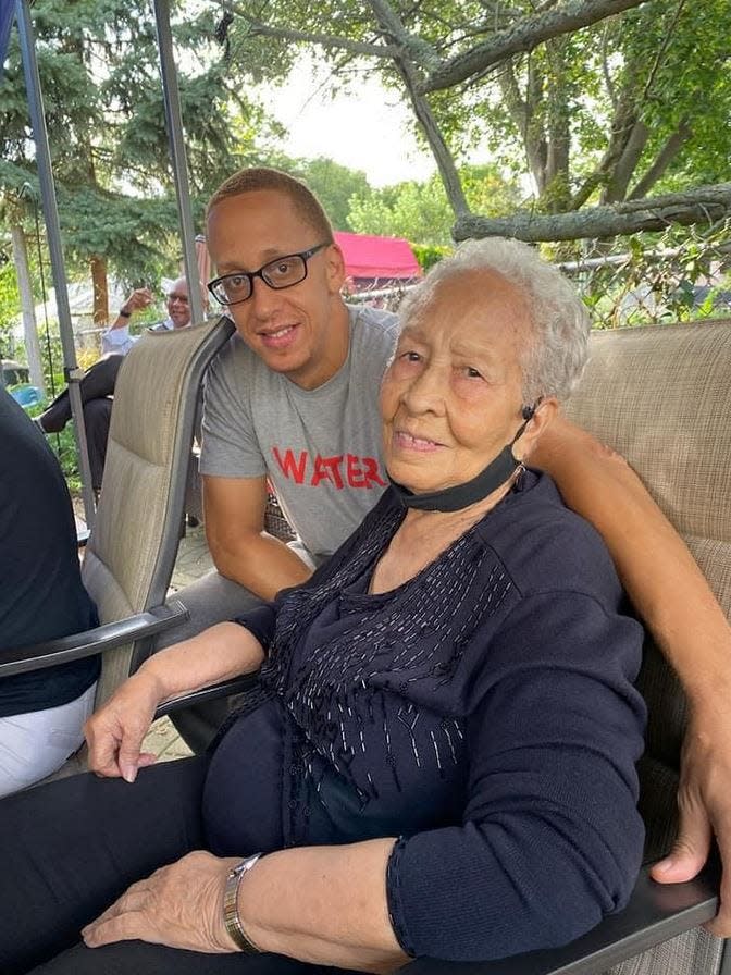Marques Houtman with his grandmother, Maria Silva.