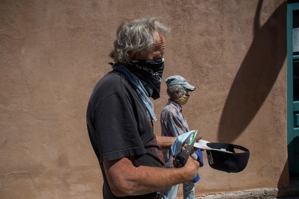 Timothy Dusharm waits in line to enter the Hillsboro Community Center in New Mexico where he received a COVID-19 vaccination.