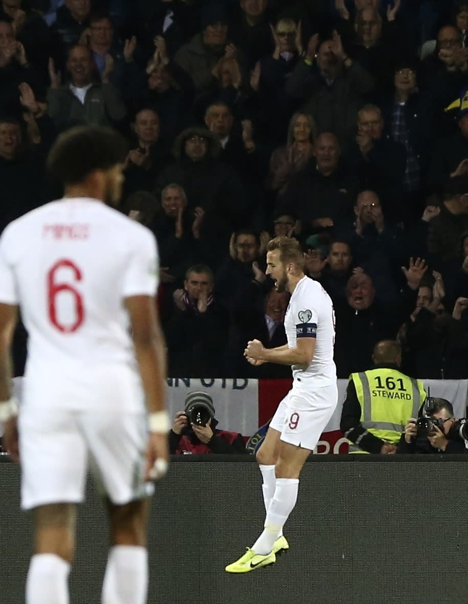 England's Harry Kane celebrates after scoring his side's second goal during the Euro 2020 group A qualifying soccer match between Kosovo and England at Fadil Vokrri stadium in Pristina, Kosovo, Sunday, Nov. 17, 2019. (AP Photo/Boris Grdanoski)