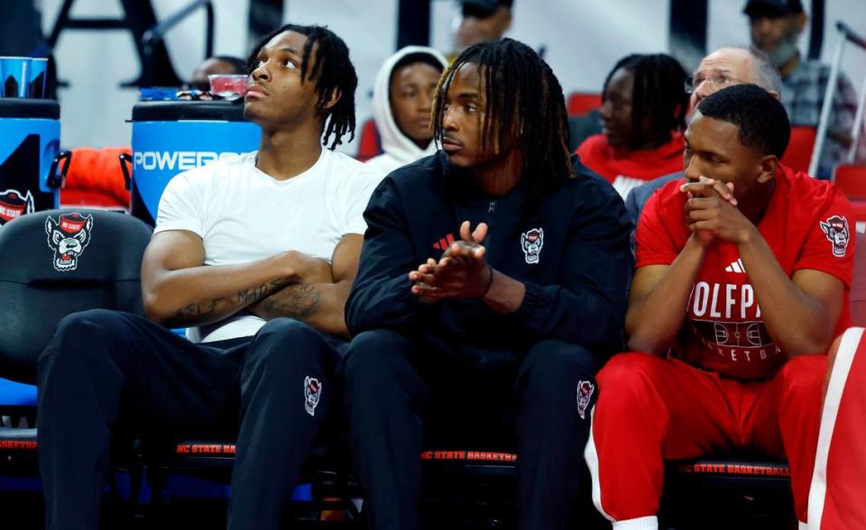N.C. State’s MJ Rice, left, Kam Woods, center, and KJ Keatts watch during the second half of N.C. State’s 89-76 exhibition victory over Mount Olive at PNC Arena in Raleigh, N.C., Wednesday, Nov. 1, 2023.