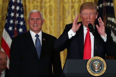 U.S. President Donald Trump, next to ‪Vice President Mike Pence‬, delivers remarks at a meeting of the National Space Council at the White House in Washington, U.S. June 18, 2018. REUTERS/Jonathan Ernst