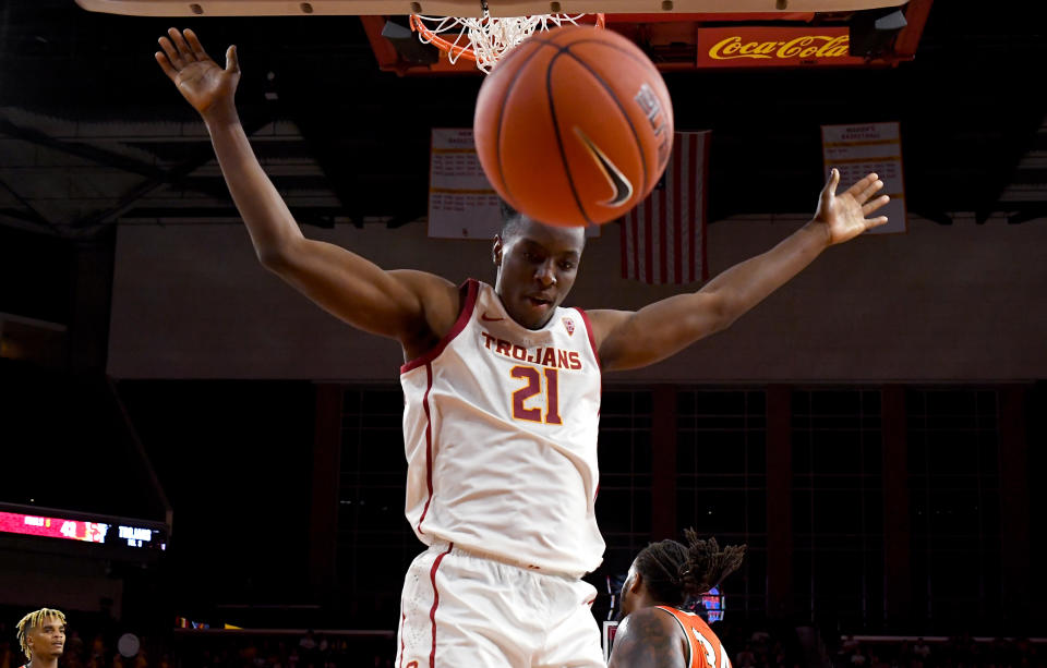 Onyeka Okongwu #21 of the USC Trojans gets by Evins Desir #34 of the Florida A&M Rattlers for a dunk in the second half of the game at Galen Center on November 5, 2019 in Los Angeles, California.