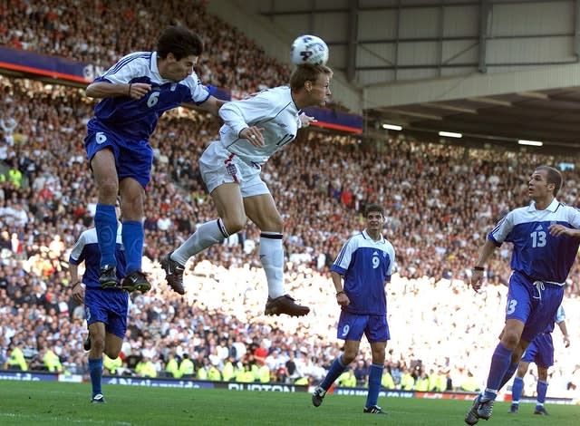 England’s Teddy Sheringham scores against Greece to keep alive their hopes of topping Group Nine