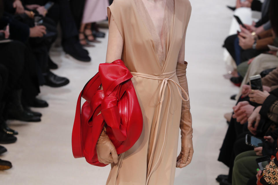 A model wears a creation for the Valentino fashion collection during Women's fashion week Fall/Winter 2020/21 presented in Paris, Sunday, March 1, 2020. (AP Photo/Francois Mori)