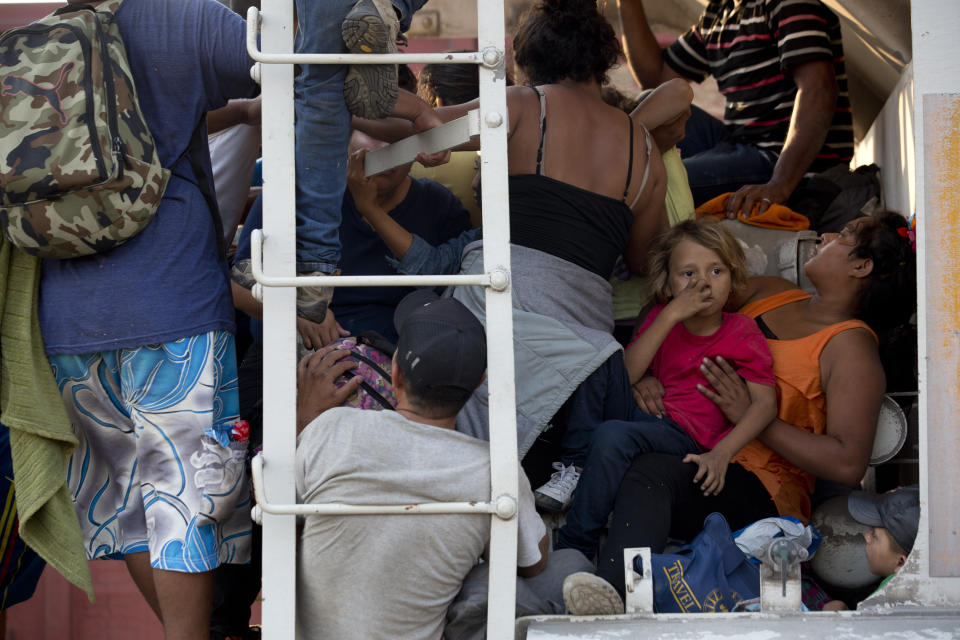 Central American migrants cram into a freight train during their journey toward the U.S.-Mexico border, in Ixtepec, Oaxaca State, Mexico, Tuesday, April 23, 2019. "They're riding the train again, that's a fact," said migrant rights activist Rev. Alejandro Solalinde, who's shelter now houses about 300 train-riding migrants. "It's going to go back to the way it was, the (Mexican) government doesn't want them to be seen. (AP Photo/Moises Castillo)