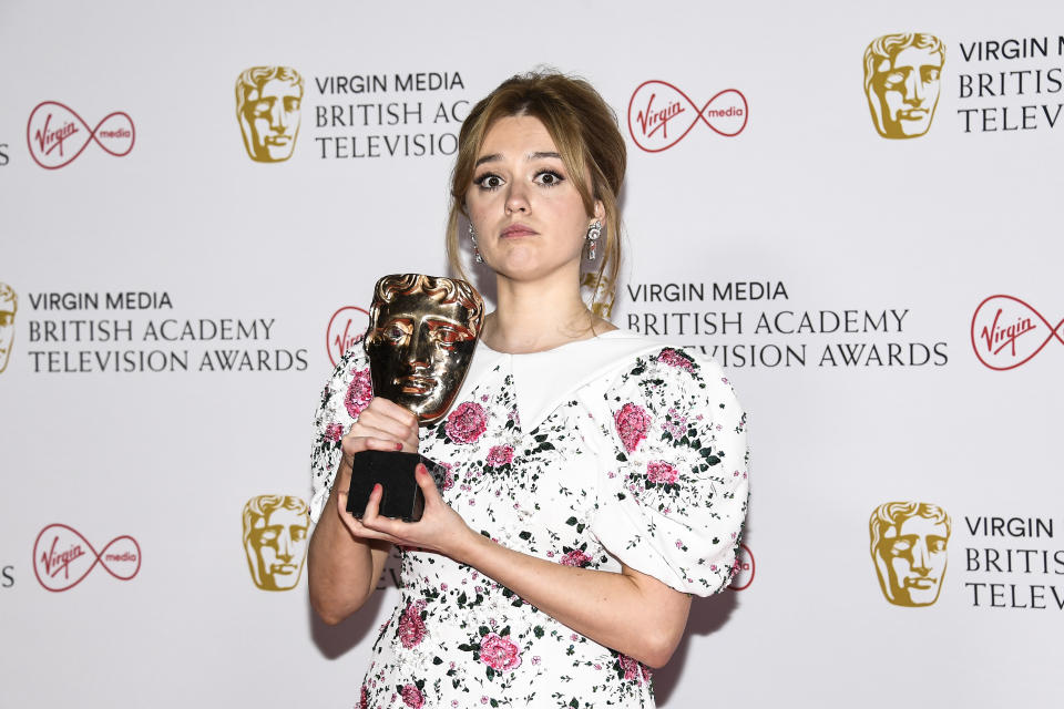 Aimee Lou Wood poses for photographers with her Best Female Performance for a Comedy Programme for her role in 'Sex Education' backstage at the British Academy Television Awards in London, Sunday, June 6, 2021. (AP Photo/Alberto Pezzali)