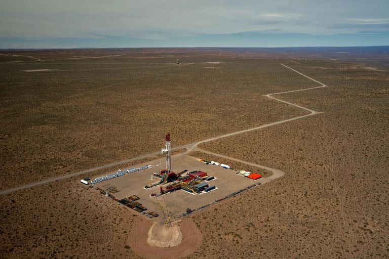 Aerial view of a gas well drilling at Campo Maripe, a field claimed by the Mapuche indigenous community, in Anelo, Neuquen province, Argentina, in the Vaca Muerta Formation, on November 27, 2019. - Vaca Muerta is an enormous non-conventional oil and gas deposit nestled in a geologic formation. It occupies over 30,000 square kilometers in the states of Neuquen, Rio Negro, La Pampa and Mendoza and provides 43% of the total oil production and 60% of the gas production of Argentina. (Photo by Emiliano Lasalvia / AFP)