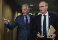 European Union chief Brexit negotiator Michel Barnier, left, speaks with Irish Foreign Minister Simon Coveney prior to a meeting at EU headquarters in Brussels on Tuesday, Oct. 8, 2019. (Stephanie Lecocq, Pool Photo via AP)