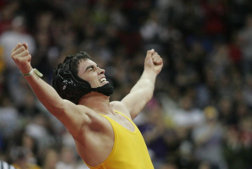 2009: Bart Reiter, Don Bosco (Gilbertville), celebrates his fourth state title championship over Cameron Wagner, Belle Plaine, in the Class 1-A wrestling finals.