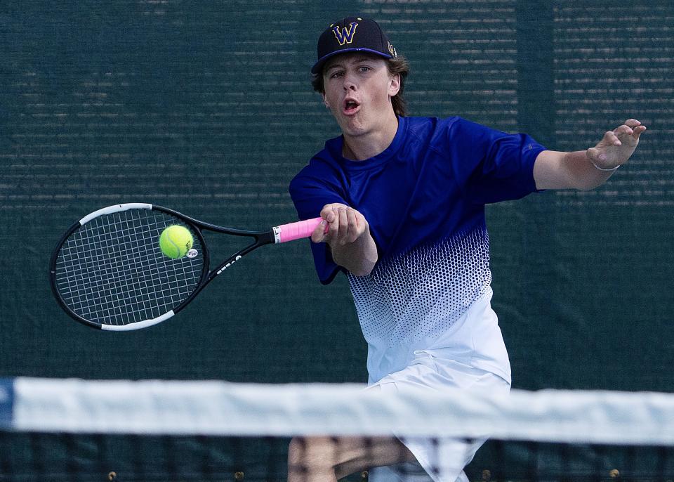 Justin Remmers of Watertown reaches to make a forehand return during one of his third flight singles mataches during the opening day of the state Class AA high school boys tennis tournament on Thursday, May 16, 2024 at Rapid City.