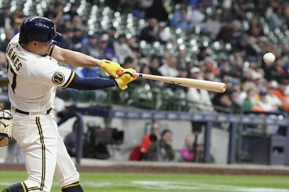 Milwaukee Brewers' Willy Adames hits a double during the fifth inning of a baseball game against the San Francisco Giants Thursday, May 25, 2023, in Milwaukee. (AP Photo/Morry Gash)