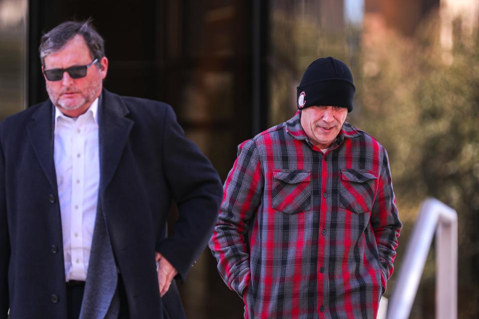 Chad Stark, right, follows his attorney Horatio Aldredge out of the federal courthouse in downtown Austin after a short hearing Friday.