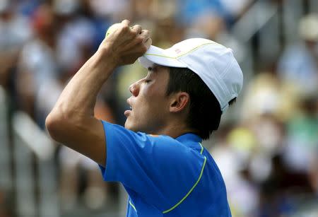 Kei Nishikori of Japan reacts after losing a point to Benoit Paire of France during their match at the U.S. Open Championships tennis tournament in New York, August 31, 2015. REUTERS/Mike Segar