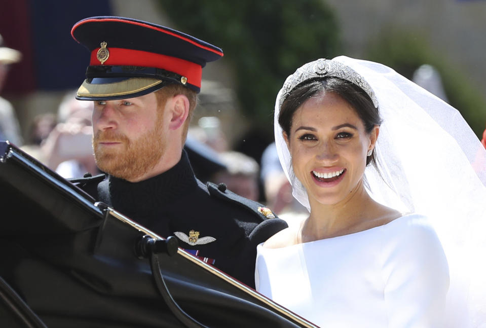 Britain’s Prince Harry and his wife Meghan Markle leave after their wedding ceremony. Source: AP