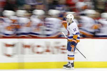 Jan 18, 2019; Washington, DC, USA; New York Islanders right wing Josh Bailey (12) celebrates with teammates after scoring a goal against the Washington Capitals in the third period at Capital One Arena. The Islanders won 2-0. Mandatory Credit: Geoff Burke-USA TODAY Sports