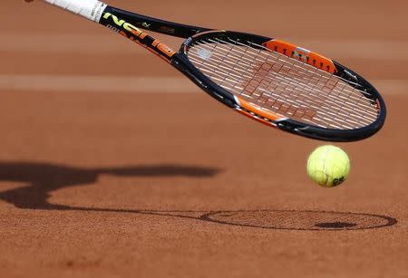 A close-up shows the racket of Simona Halep of Romania during the women's singles match against Evgeniya Rodina of Russia at the French Open tennis tournament at the Roland Garros stadium in Paris, France, May 24, 2015. REUTERS/Vincent Kessler TPX IMAGES OF THE DAY