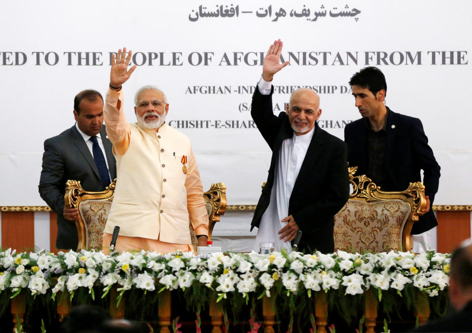 India's Prime Minister Narendra Modi (L) and Afghanistan's president Ashraf Ghani wave after the inauguration of the Salma Dam in Herat province, Afghanistan June 4, 2016. REUTERS/Omar Sobhani 