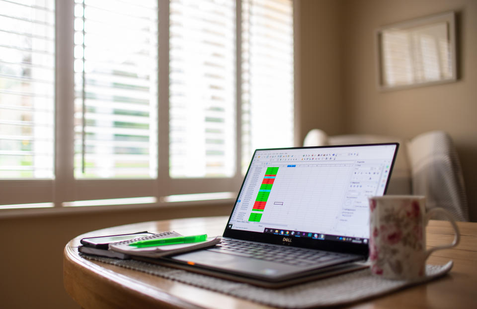 File photo dated 04/03/20 of a laptop on a dining room table set up as a remote office to work from home. One in three British workers does not think they will not be back in their office or other workplace until at least next year, according to a new survey.