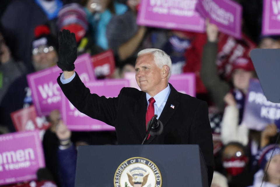 Vice President Mike Pence acknowledges the crowd during a campaign event, Monday, Nov. 2, 2020, in Grand Rapids, Mich. (AP Photo/Carlos Osorio)
