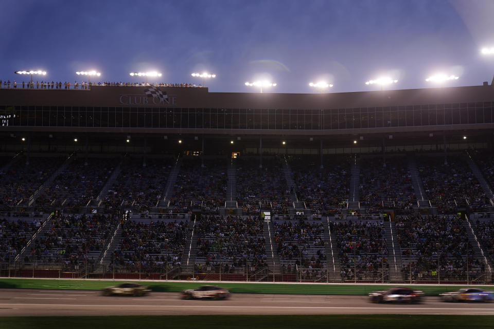 Rain rolls in as xars drive during a NASCAR Cup Series auto race at Atlanta Motor Speedway on Sunday, July 9, 2023, in Hampton, Ga. (AP Photo/Brynn Anderson)