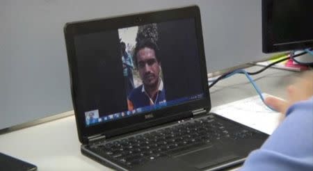 Ata Ullah, who has been identified by analysts and local people as the leader of Rohingya Muslim insurgency Arakan Rohingya Salvation, is seen on a laptop screen during a Skype interview with Reuters in Yangon Myanmar, in this still image taken from video taken March 31, 2017. REUTERS TV/Files