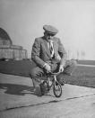 Chicago bicycle dealer Andy Koslow rides a tiny bike built by a former vaudevillian. "This helps limber up his left leg," LIFE wrote, "which, as a former motorcycle racer, he broke seven times." (Wallace Kirkland—Time & Life Pictures/Getty Images)