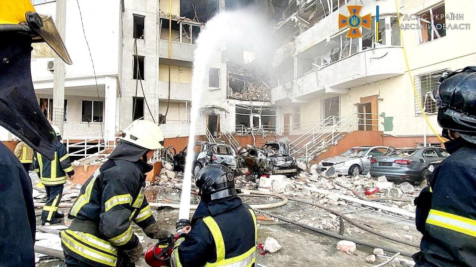 Emergency service workers extinguish fire after a missile strike in Odesa (via REUTERS)